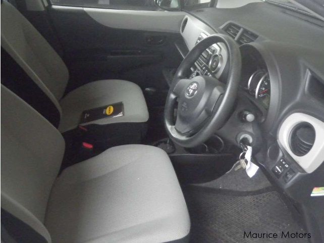 Toyota VITZ F SMART STOP GRADE - WHITE in Mauritius